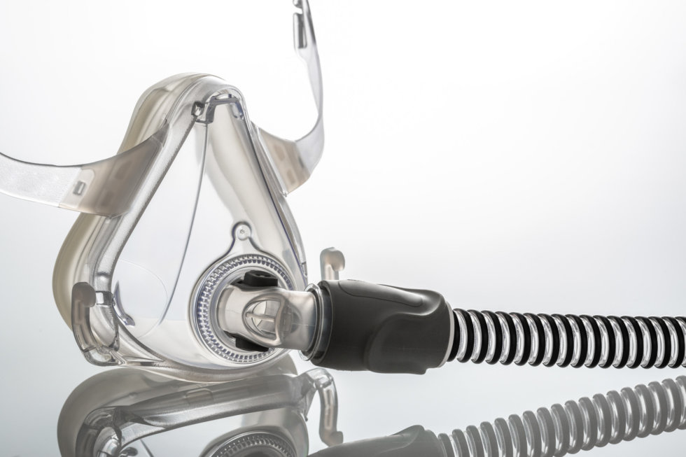 Sleep apnea CPAP mask on the white background